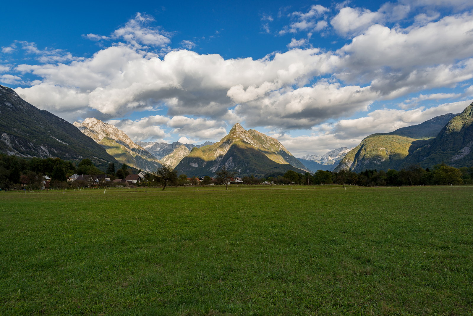 Village Bovec with mountains in the background